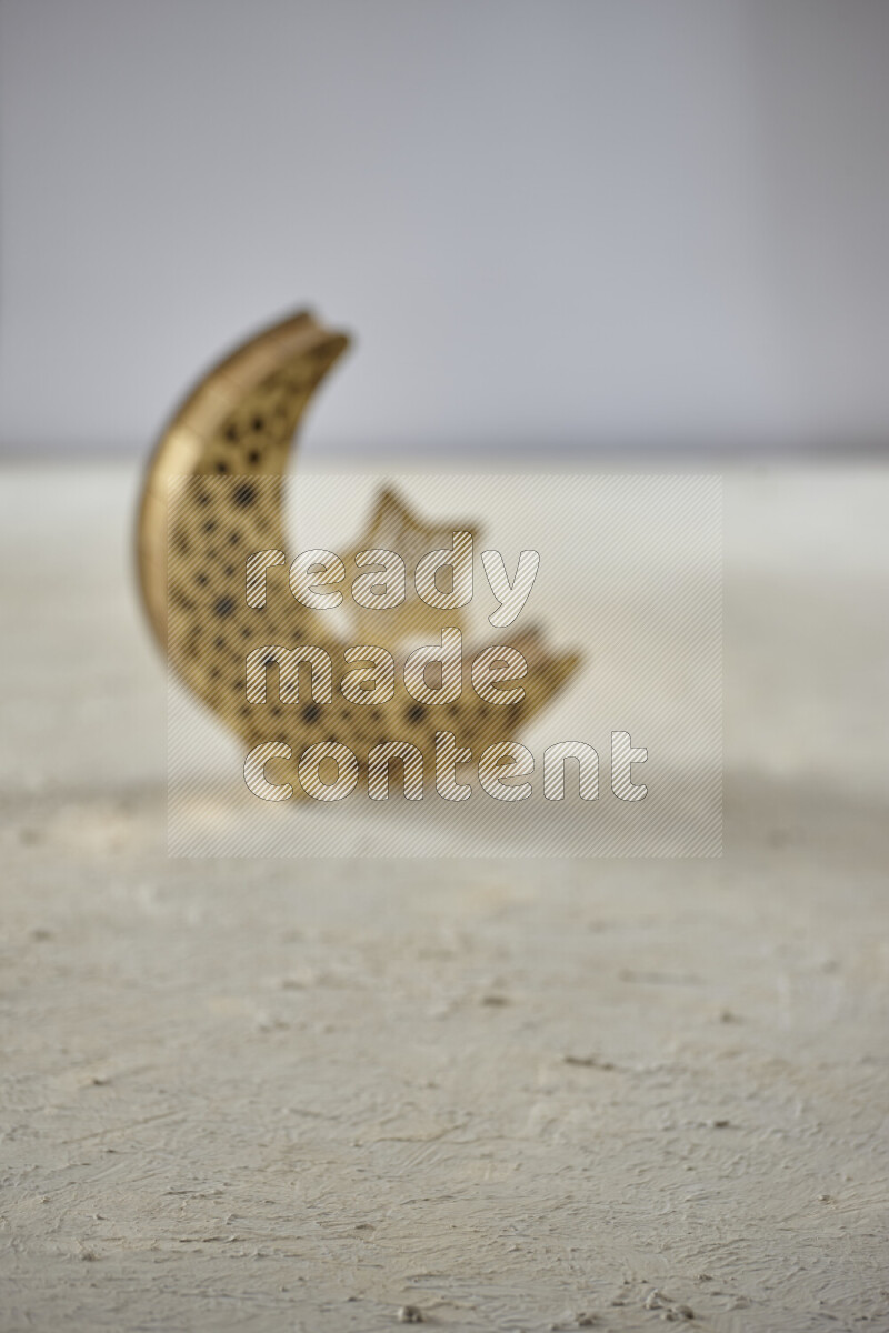 A lantern placed on a textured white background