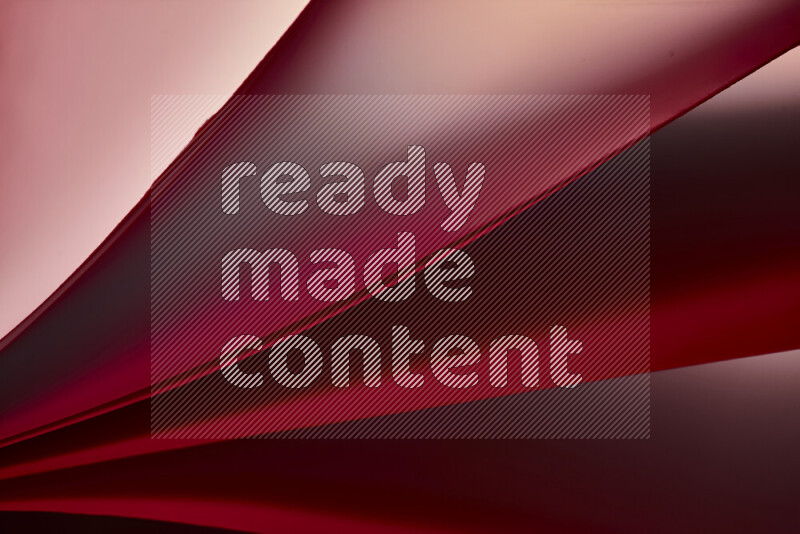 فن تجريدي يعرض منحنيات مع تدرجات الألوان الدافئة والباردة مكونه بضوء ملون