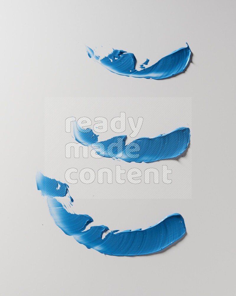 Blue painting knife strokes on white background