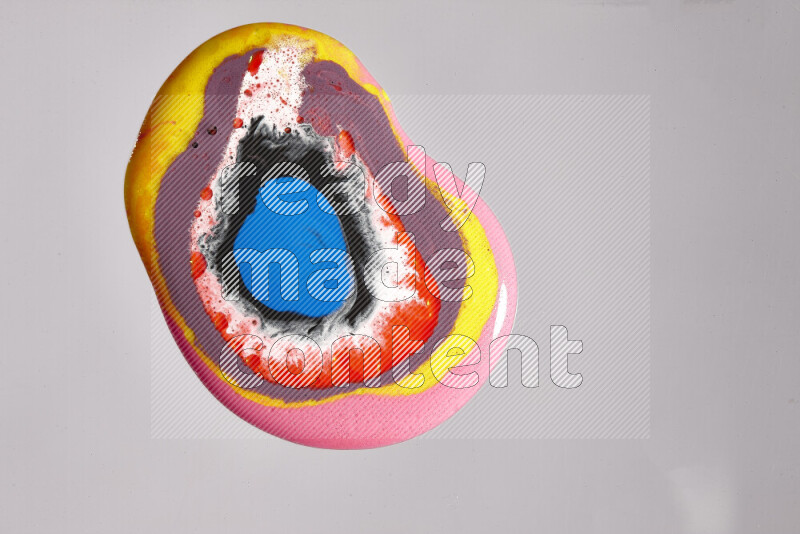 Close-ups of assorted colors blending on a grey background