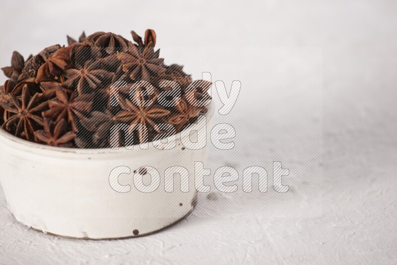 Star Anise in a white bowl on white background