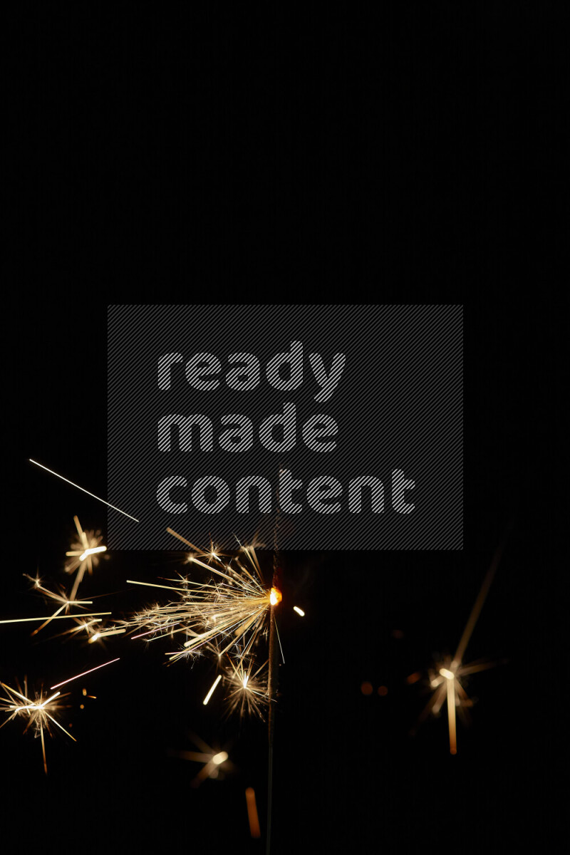 A close-up image of sparkler candle isolated on black background