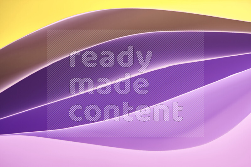 This image showcases an abstract paper art composition with paper curves in purple and gold gradients created by colored light