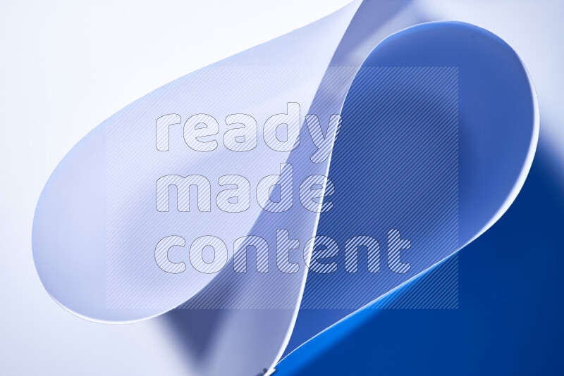 An abstract art of paper folded into smooth curves in white and blue gradients