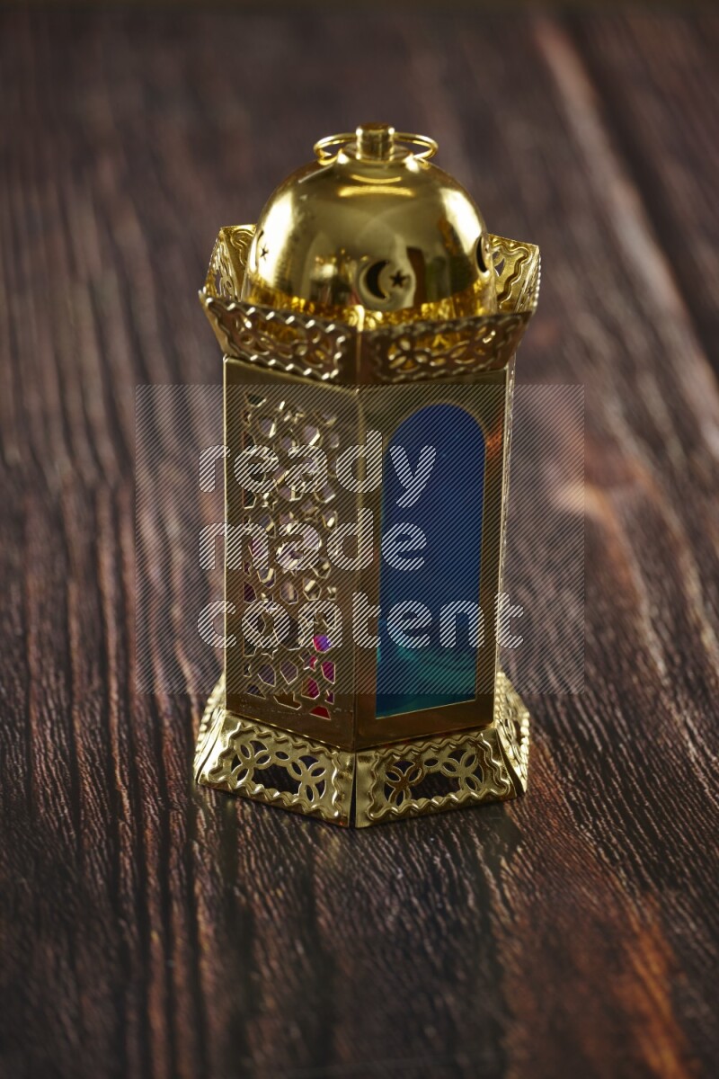 A lantern placed on a wooden background