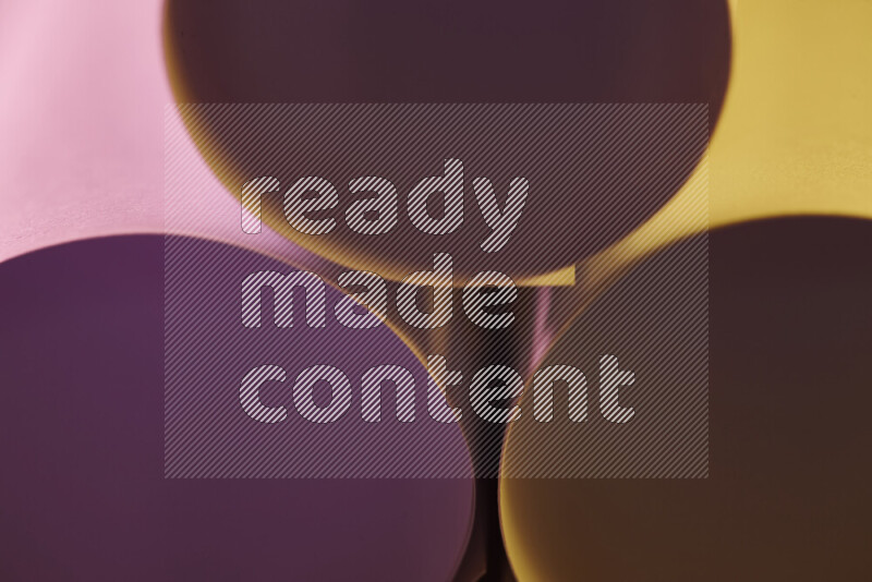 The image shows an abstract paper art with circular shapes in varying shades of pink and warm tones