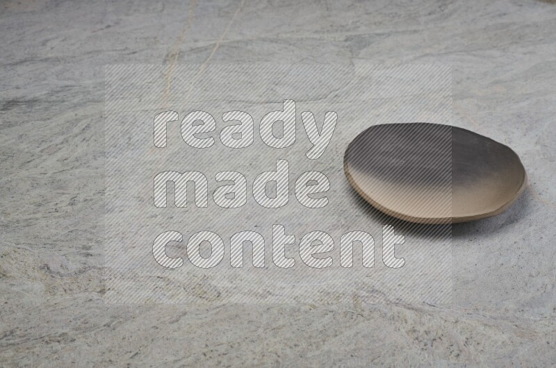 Multicolored Pottery Plate On Grey Marble Flooring