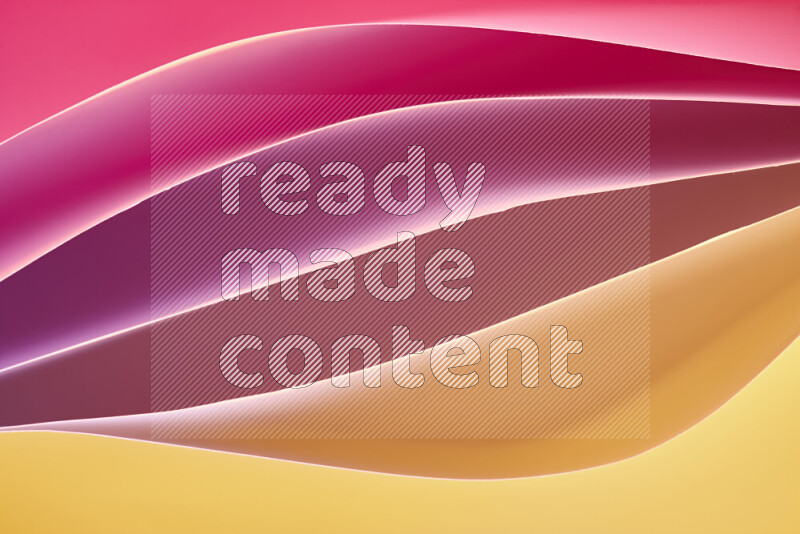 This image showcases an abstract paper art composition with paper curves in different warm gradients created by colored light