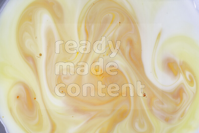 A close-up of abstract different swirling patterns in orange