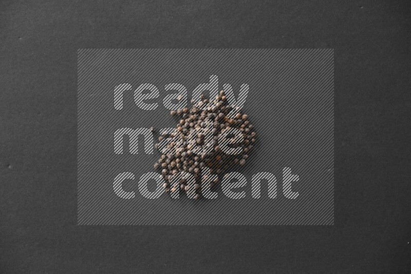Black pepper on a black flooring