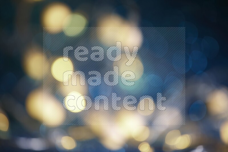 Bokeh light in yellow with blue background