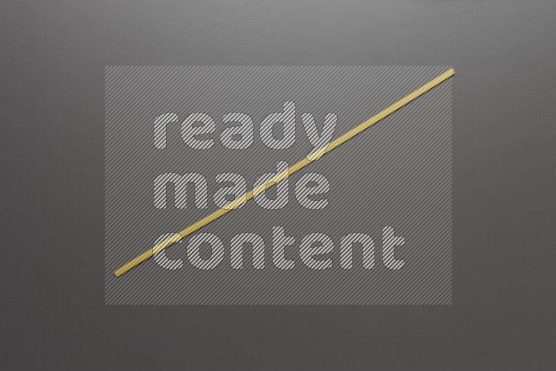 Linguini pasta on grey background