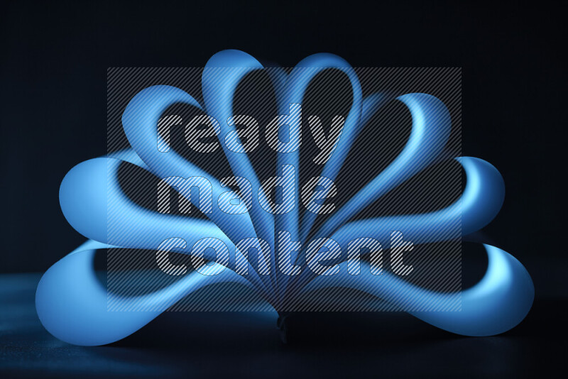 An abstract art piece displaying smooth curves in blue gradients created by colored light