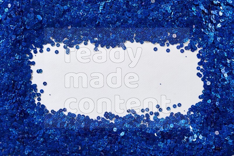 Multicolored flat sequins on grey background