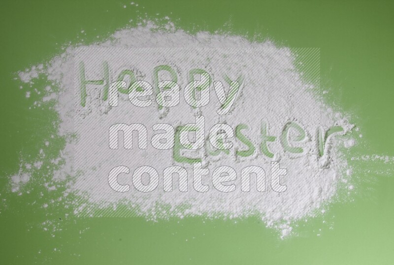 A sentence written with powder on green background
