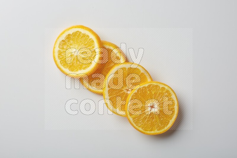Four orange slices on a white background