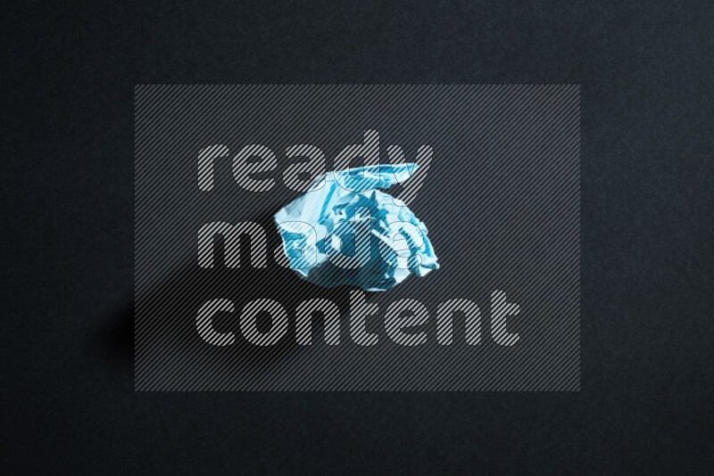 Blue paper sheet on black background