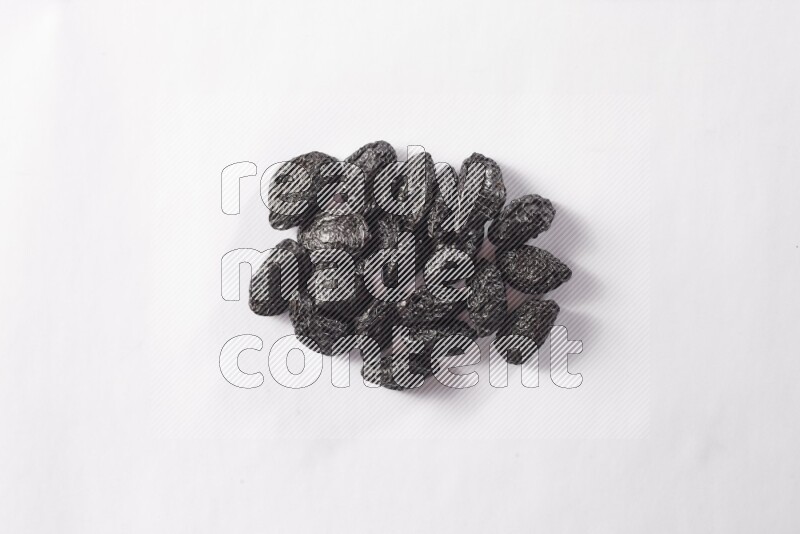 Dried plums on white background