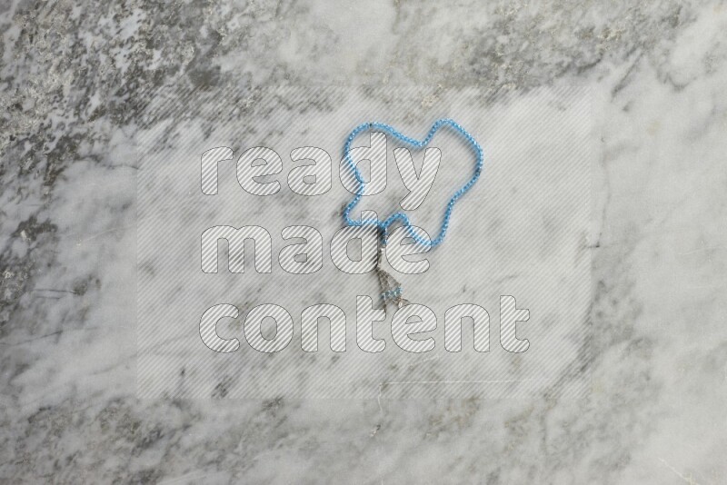 A prayer beads placed on grey marble background