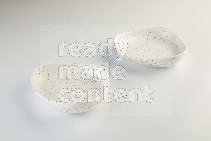 white plate with black dots on white background