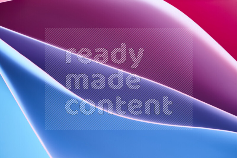 This image showcases an abstract paper art composition with paper curves in blue, purlpe and pink gradients created by colored light