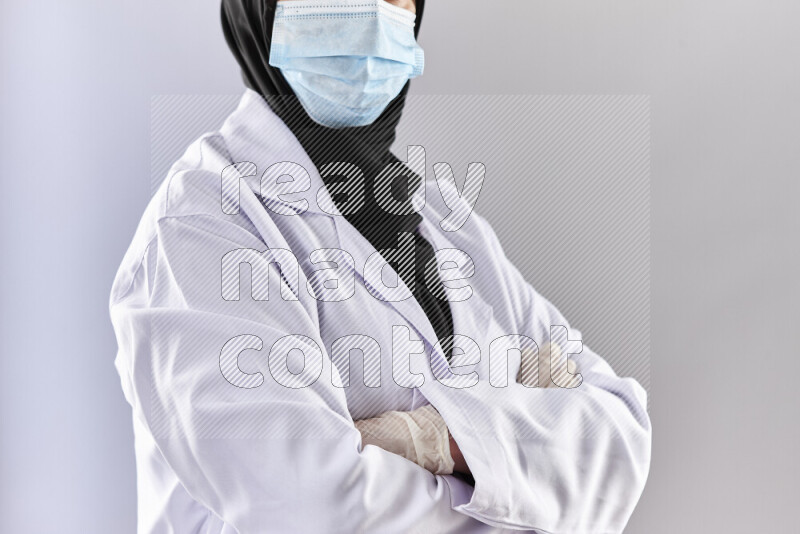 Female doctor wearing an abaya and medical attire in different positions