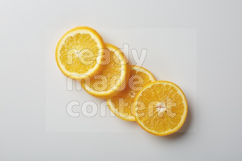 Four orange slices on a white background