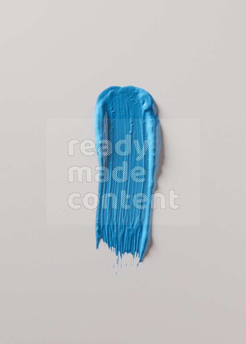 A single blue straight line brush stroke on a white background