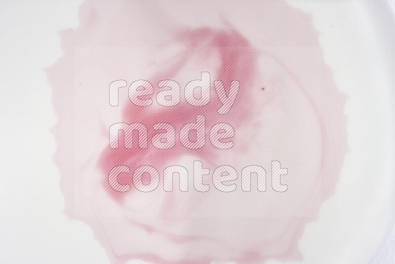 A close-up of abstract swirling patterns in red and white