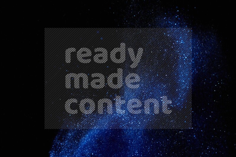 Blue glitter powder isolated on black background