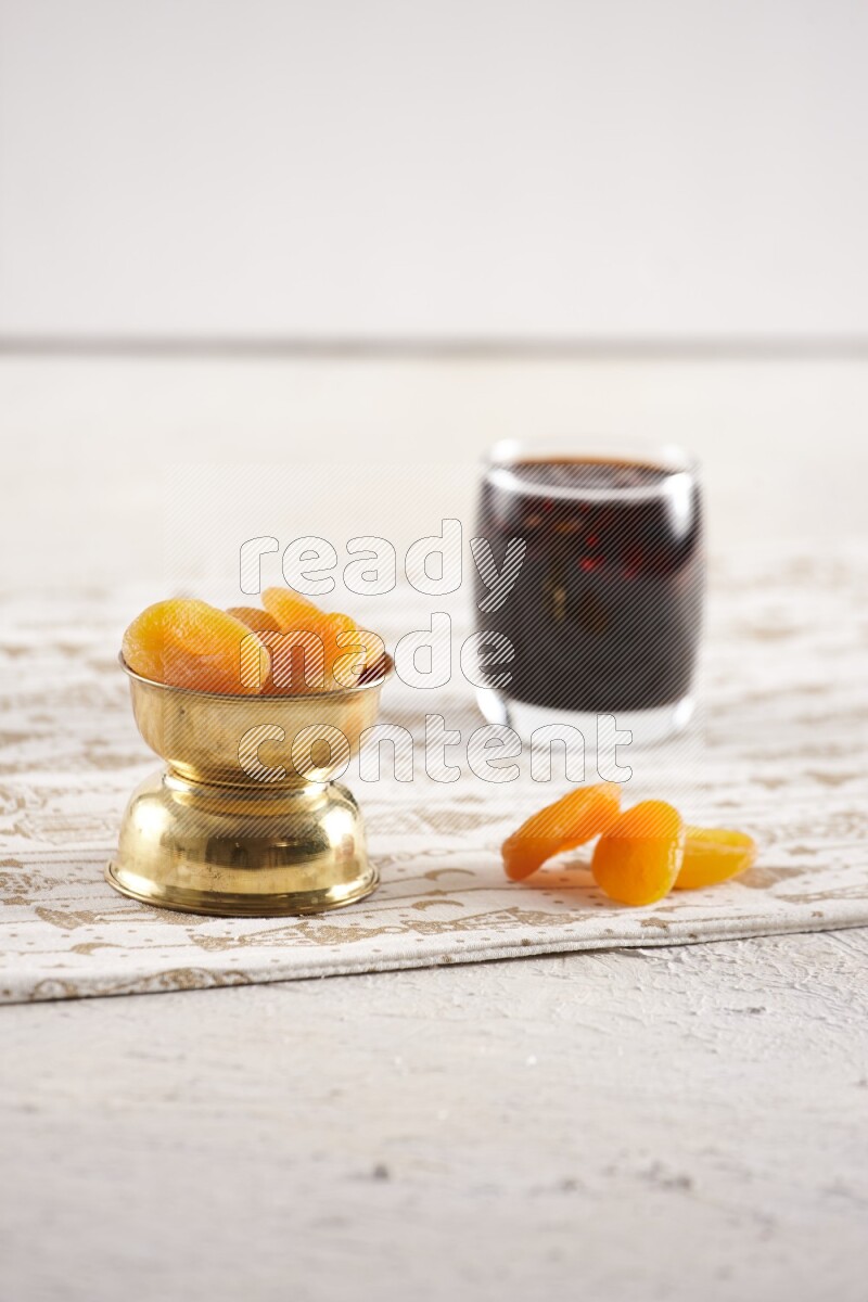 Dried fruits in a metal bowl with tamarind in a light setup
