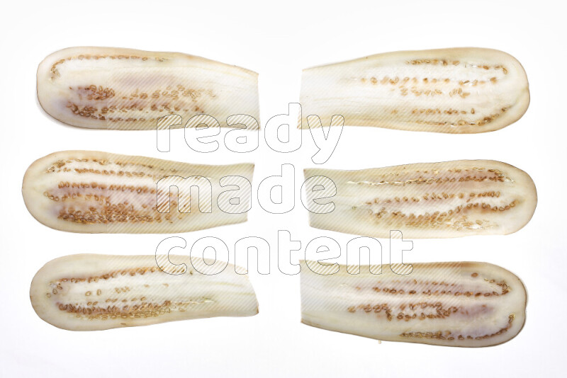 Eggplant slices on illuminated white background