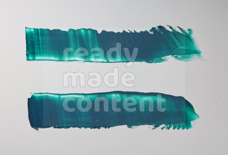 Turquoise painting knife strokes on white background