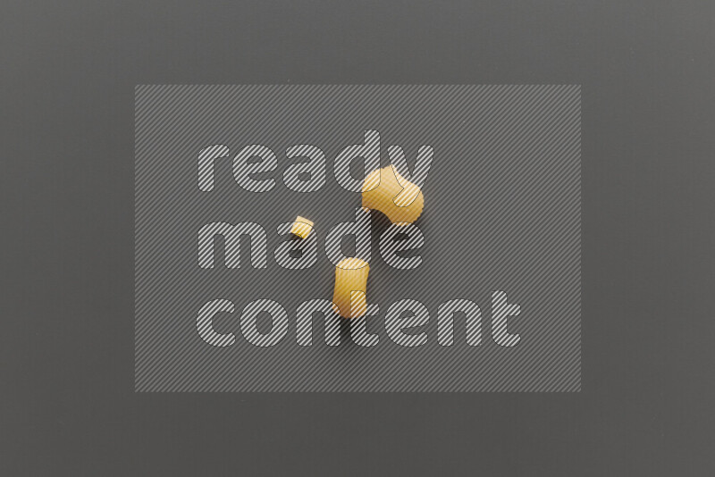 Different pasta types on grey background