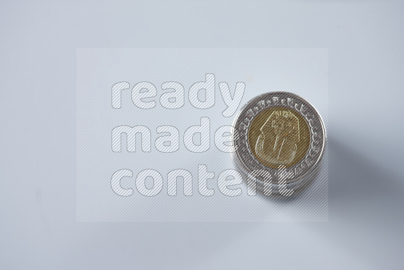 Stack Egyptian one pound coins on grey background