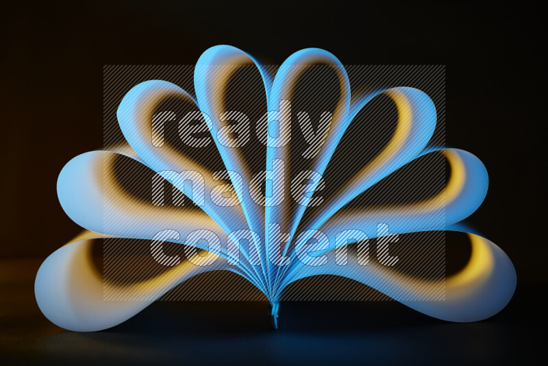 An abstract art piece displaying smooth curves in yellow and blue gradients created by colored light