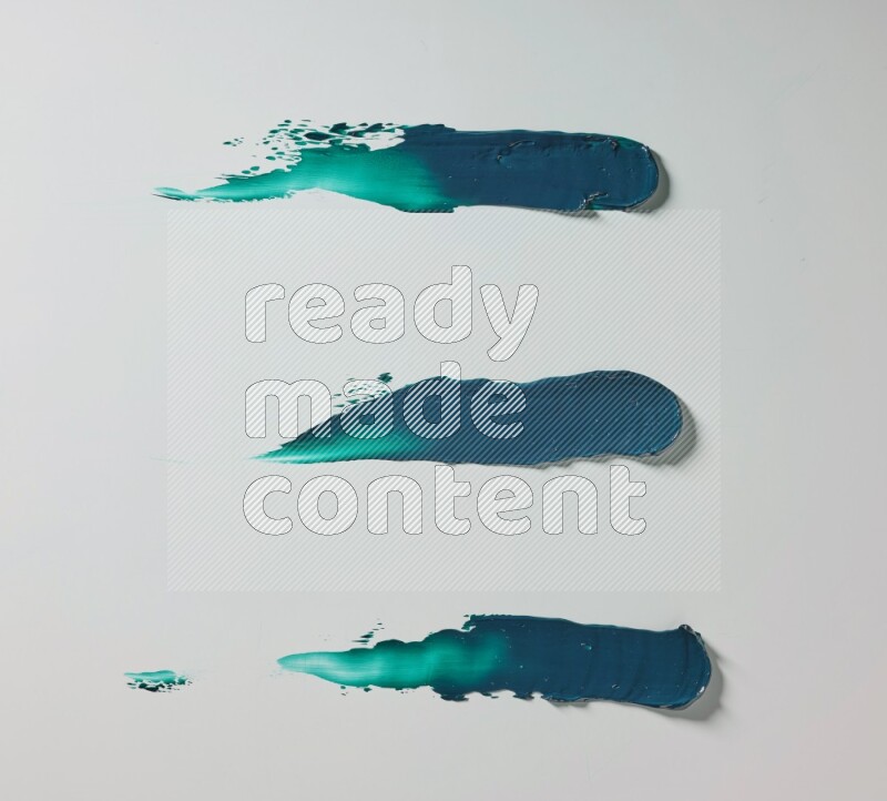 Turquoise painting knife strokes on white background