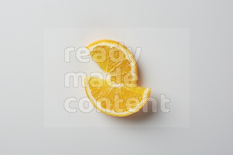 Two halves of an orange slices on white background