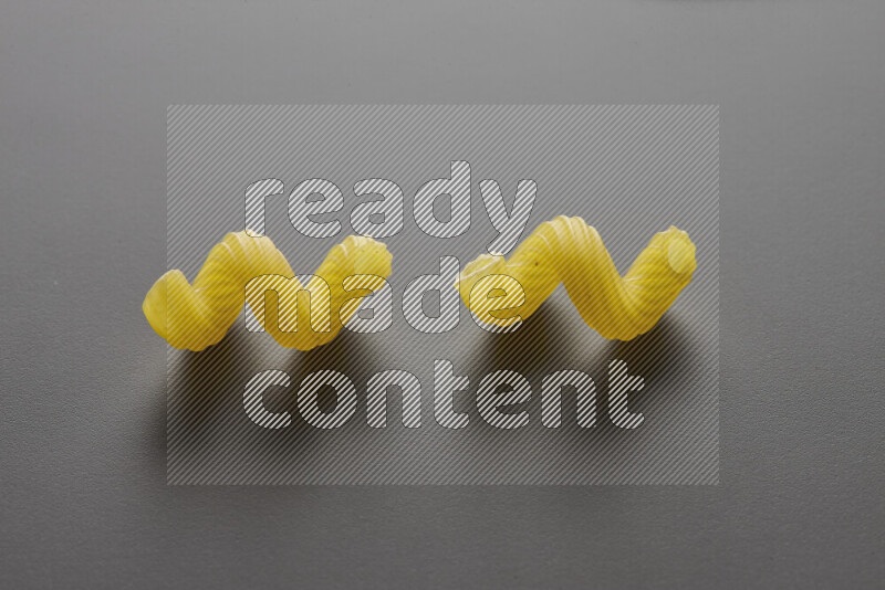Twist pasta on grey background