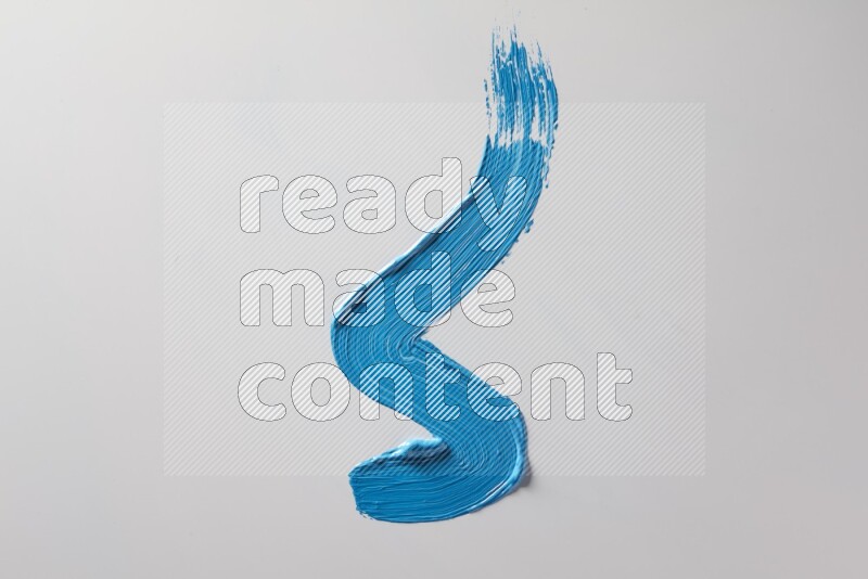 A single blue zigzag brush stroke on a white background