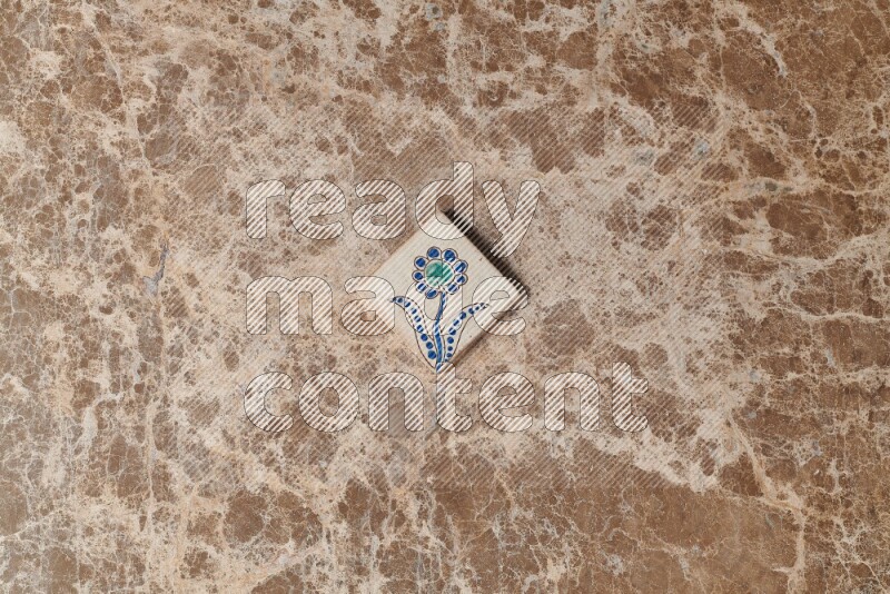 A decorative coaster on beige marble background