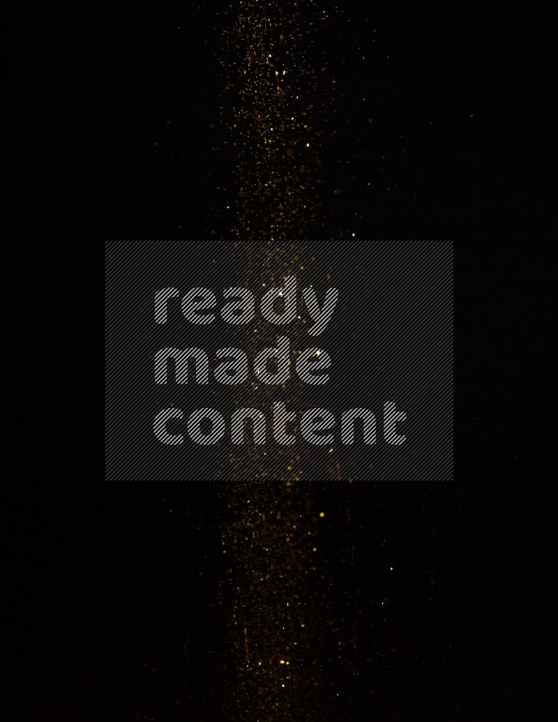Gold glitter powder isolated on black background