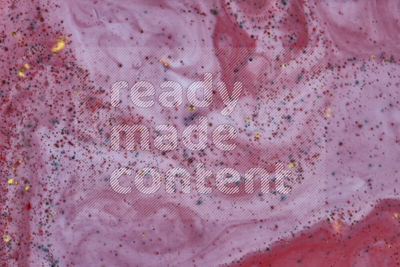 A close-up of abstract swirling patterns in red with colored particles