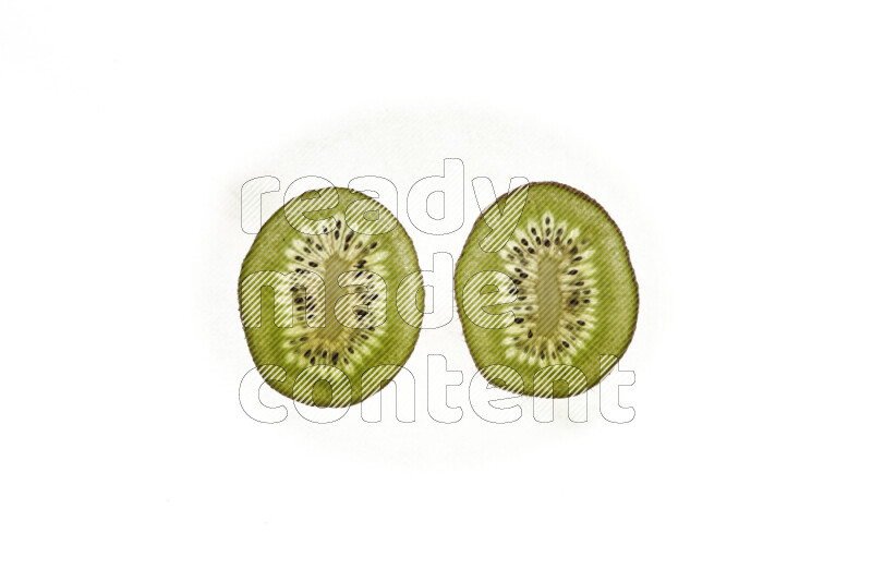 Kiwi slices on illuminated white background