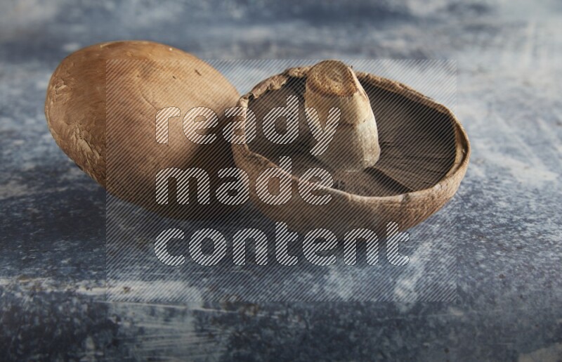 45 degre portobello mushrooms on a textured rustic blue background