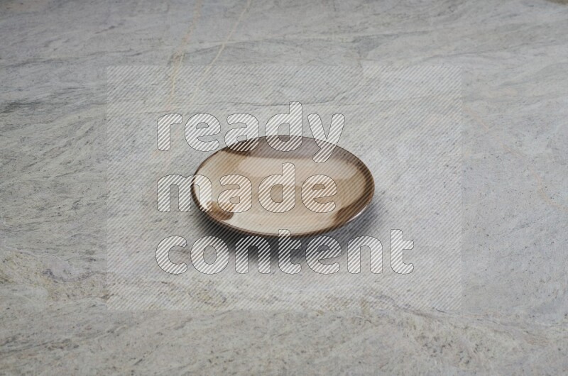 Multicolored Pottery Plate On Grey Marble Flooring
