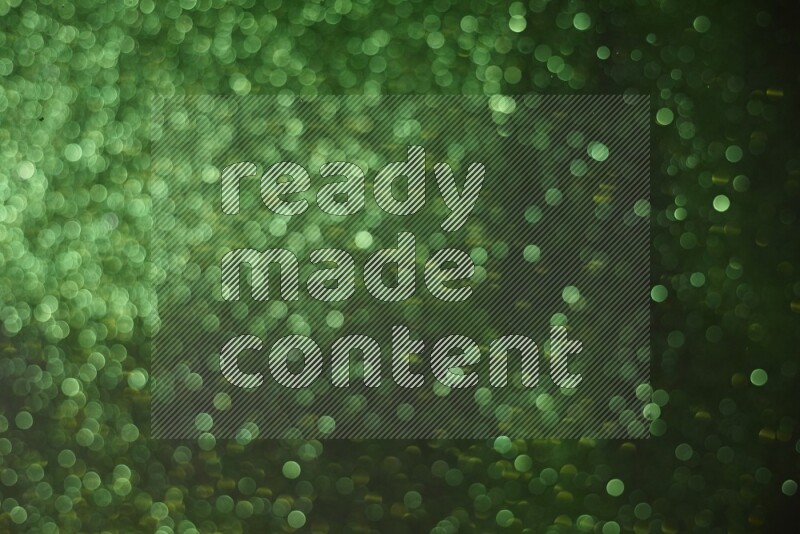 Green glitter powder isolated on black background