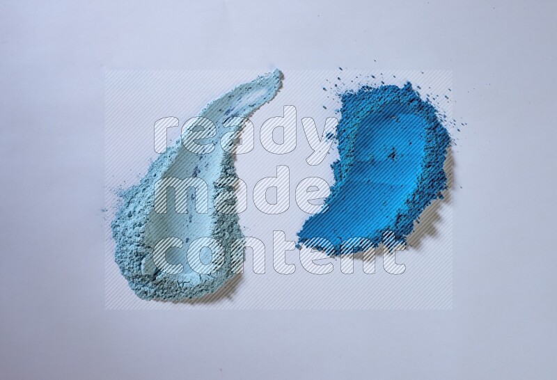 Blue powder smears on white background