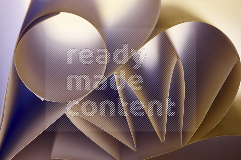 An artistic display of paper folds creating a harmonious blend of geometric shapes, highlighted by soft lighting in warm tones