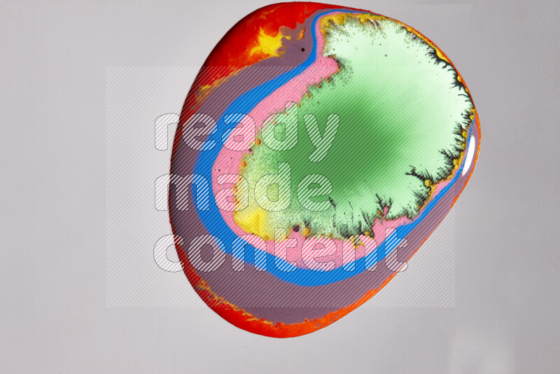 Close-ups of assorted colors blending on a grey background